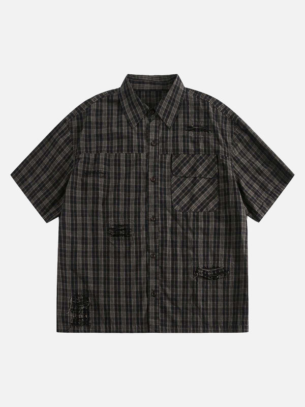Front view of a black distressed plaid short-sleeve shirt by TALISHKO, perfect for casual wear.