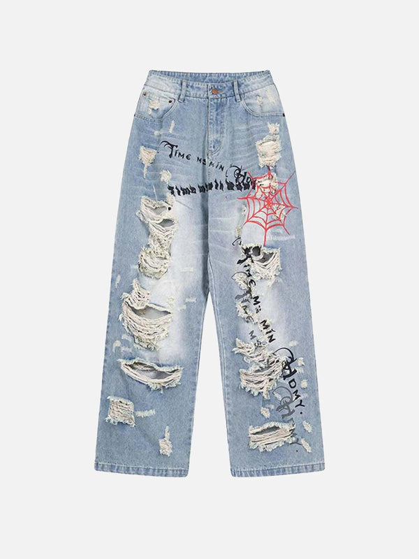 Front view of blue distressed jeans with spider web and letter print by TALISHKO, showcasing edgy style.