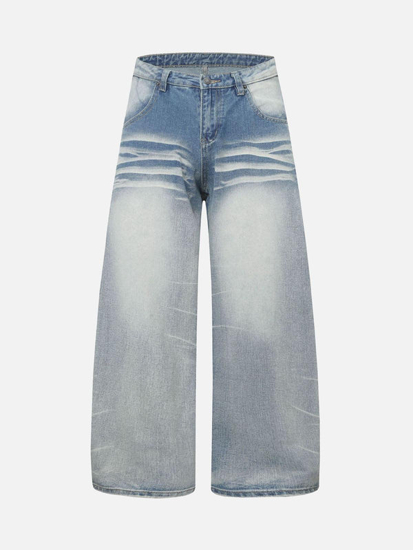 Front view of light blue barrel jeans by TALISHKO, featuring distressed whisker detailing.