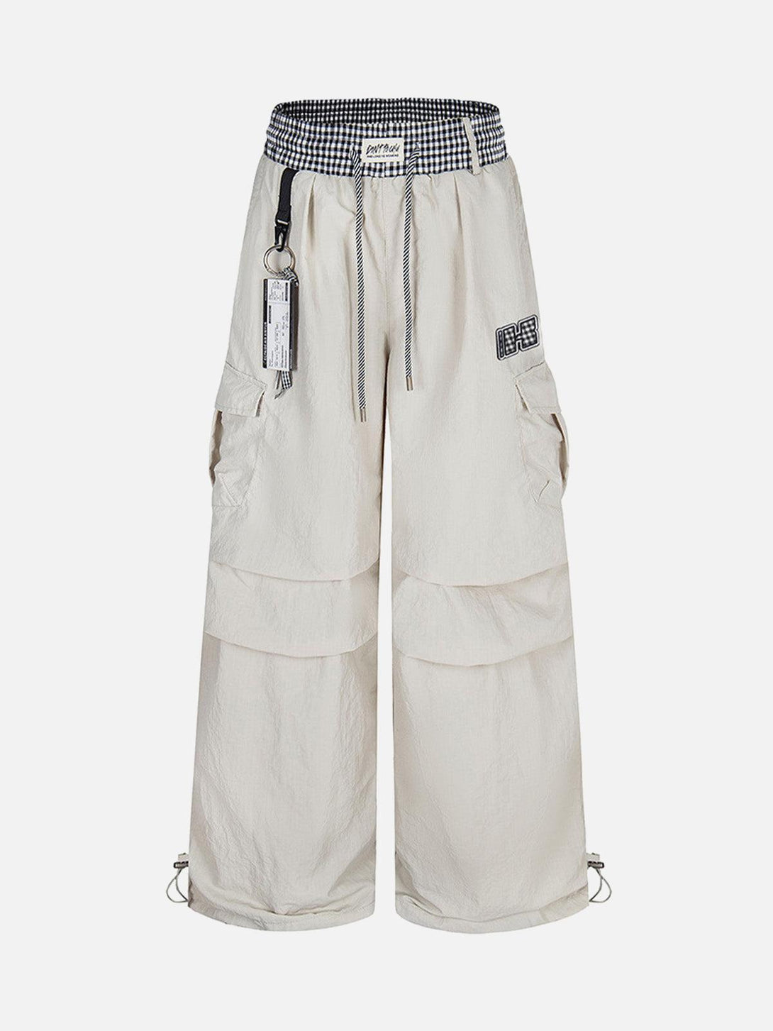 Front view of apricot baggy cargo pants with double waist drawstring, designed by TALISHKO.