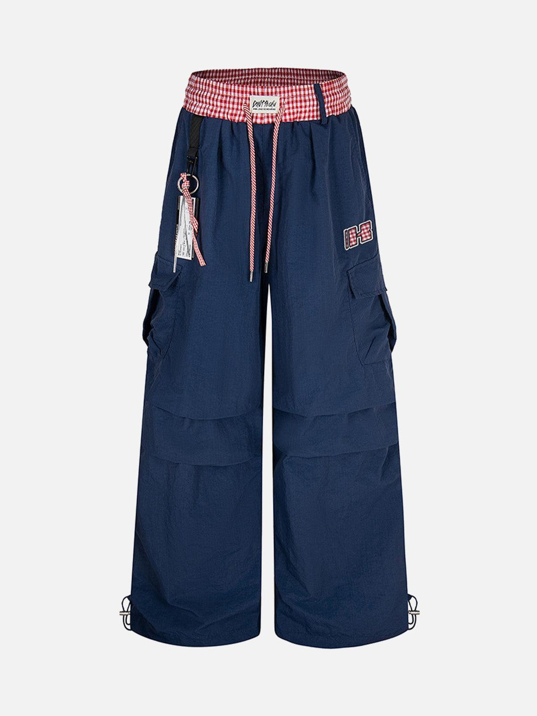 Front view of navy baggy cargo pants with double waist drawstring by TALISHKO, showcasing urban style.