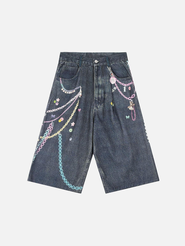 Front view of blue embellished chain denim shorts by TALISHKO, featuring colorful designs.