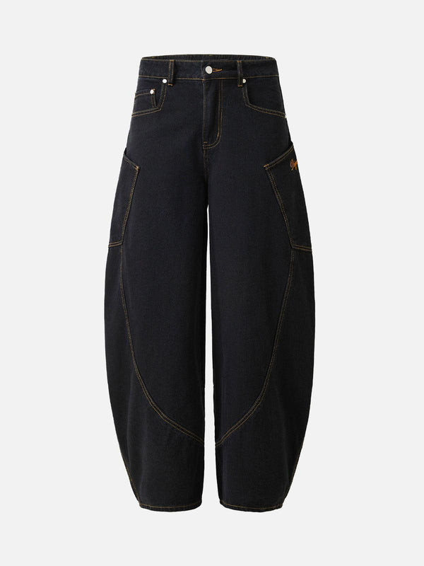 Front view of black barrel leg jeans by TALISHKO, featuring unique stitching and embroidered details.