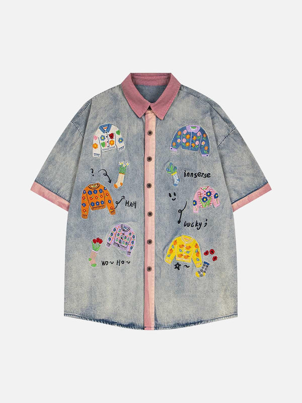 Front view of a blue embroidered patch denim shirt by TALISHKO, featuring playful designs.