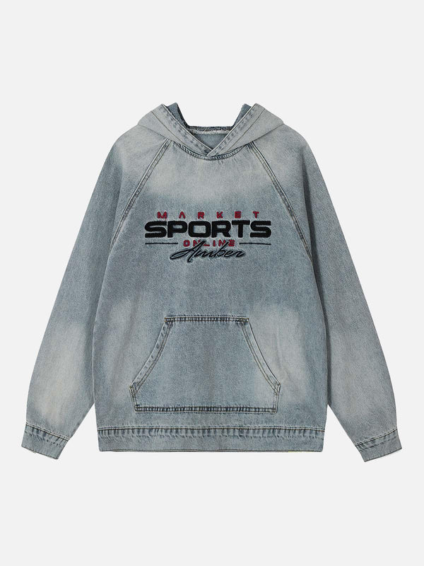 Blue denim hoodie with embroidered text by TALISHKO, showcasing a washed, distressed front.