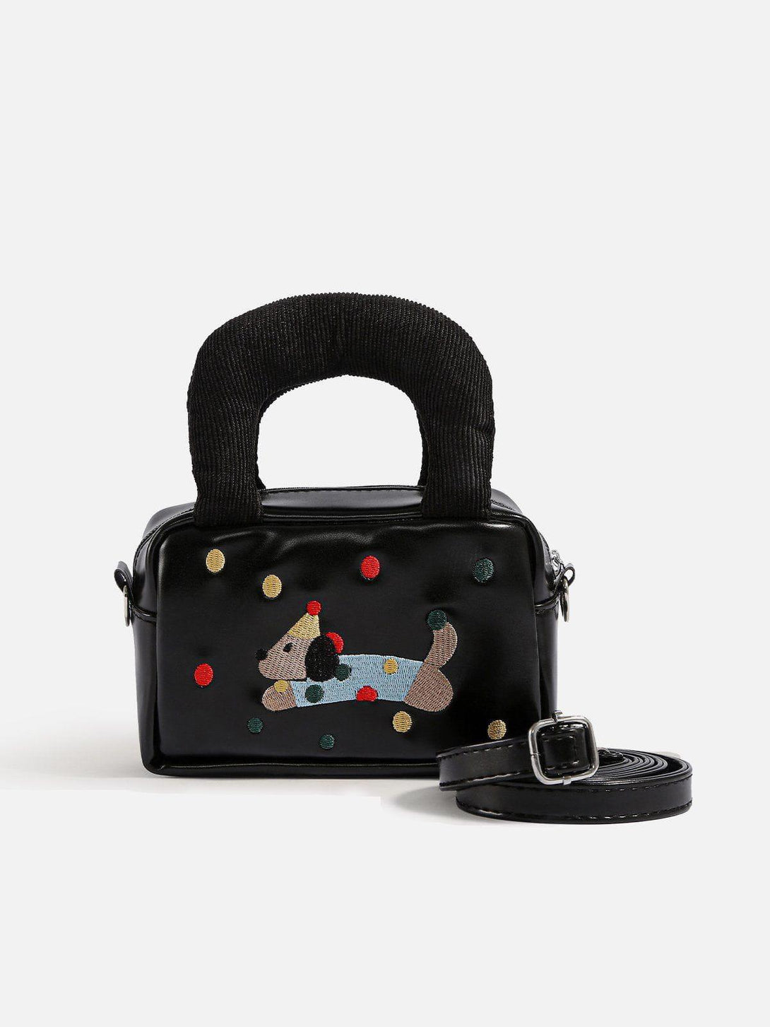 Front view of a black bag with cartoon dog embroidery and textured handles by TALISHKO.