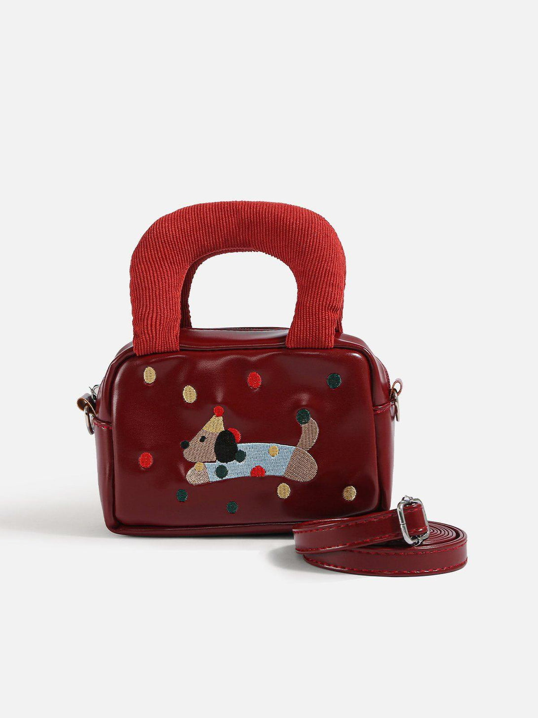 Front view of a red cartoon dog bag with textured handles and detachable strap by TALISHKO.