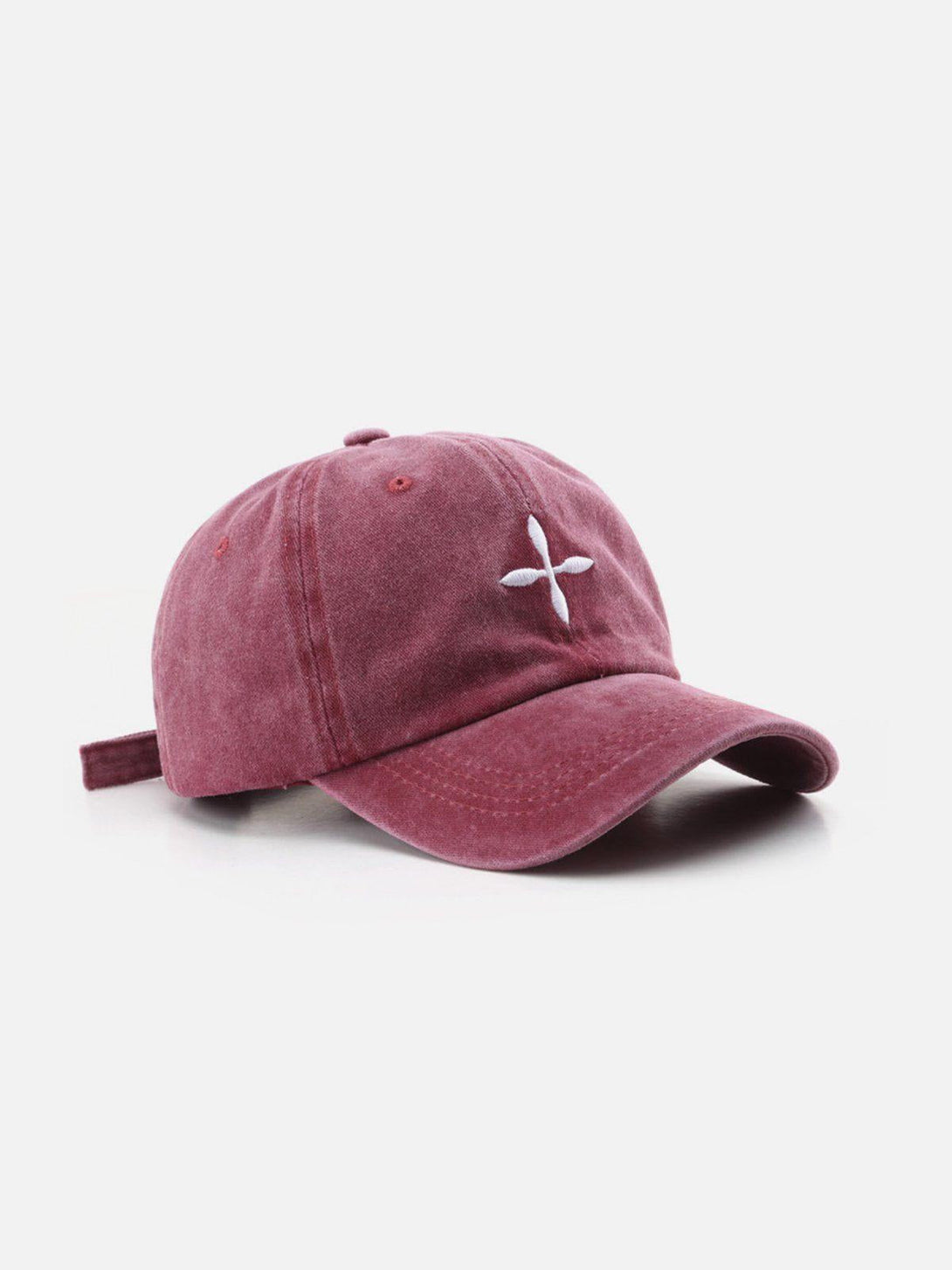 Red baseball cap with embroidered crucifix design by TALISHKO, showcasing a relaxed style.