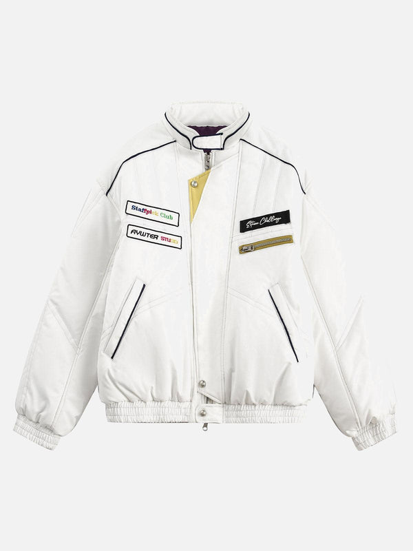 Front view of white bomber jacket by TALISHKO featuring embroidered patches and double-ended zipper.