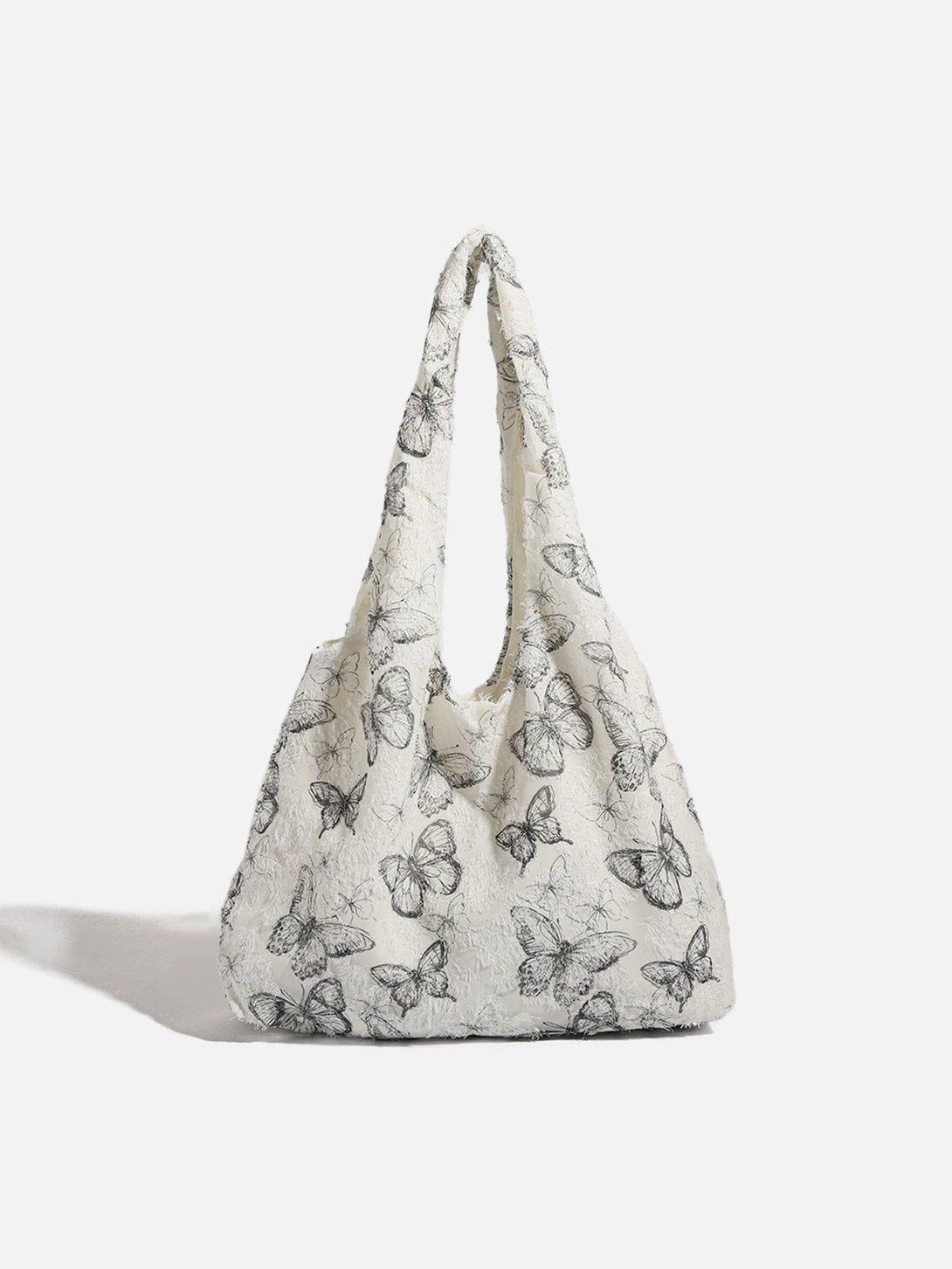 Front view of a black and white butterfly-embellished tote bag by TALISHKO.
