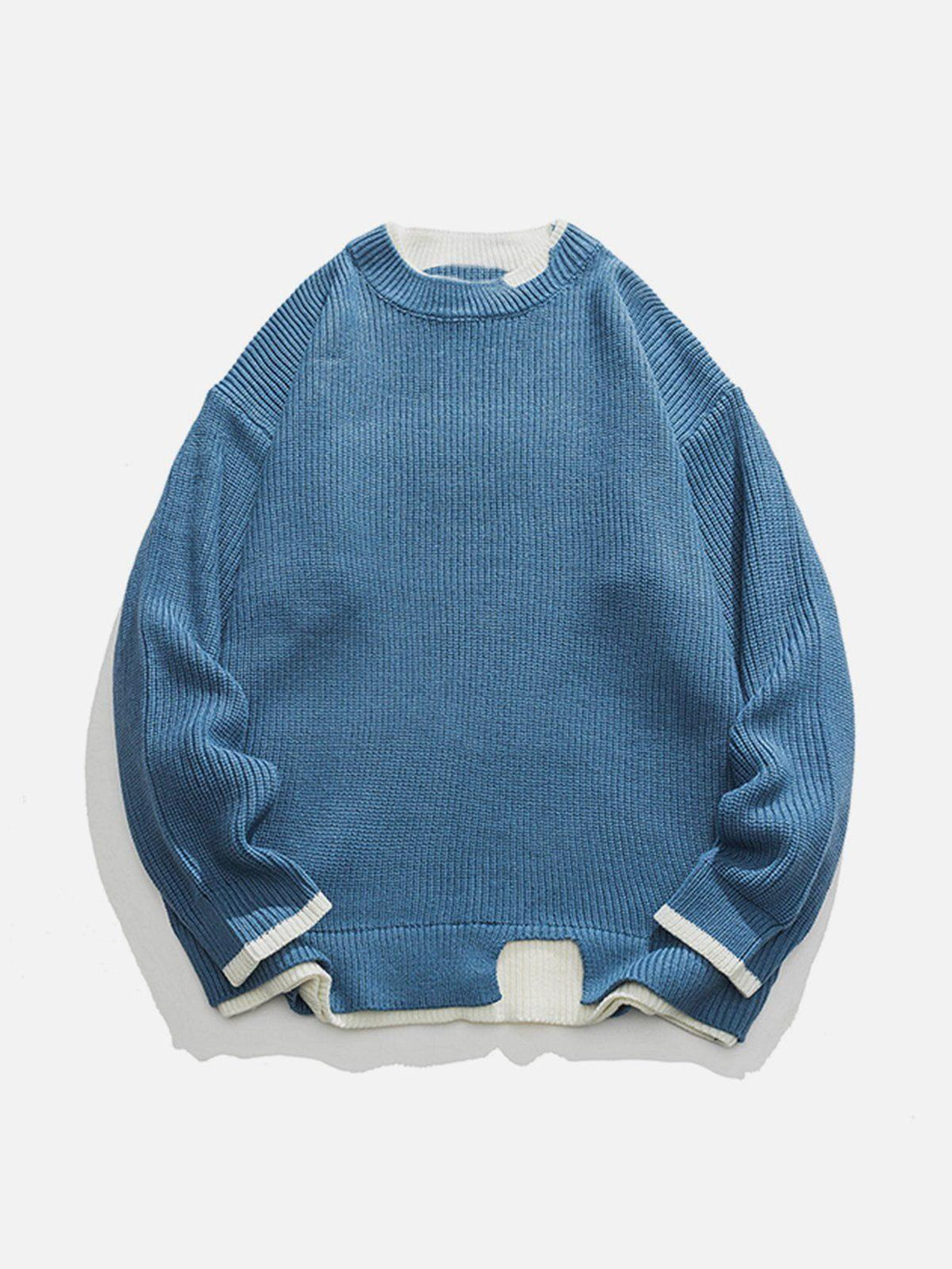 Front view of TALISHKO's blue patchwork knit sweater, featuring textured design and white accents.