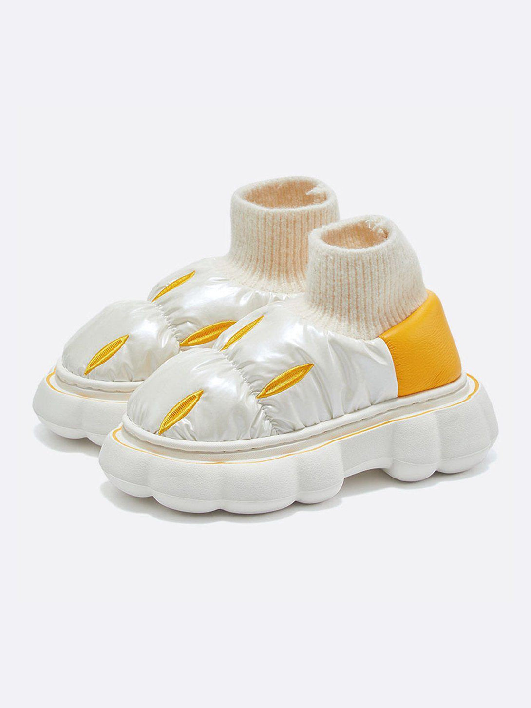 Front view of yellow cotton-padded shoes by TALISHKO, featuring cozy knit cuffs and bold design.