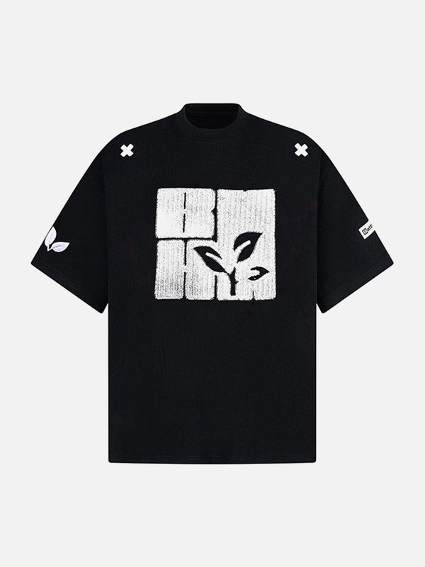 Front view of TALISHKO black floral graphic print T-shirt, showcasing bold summer style.