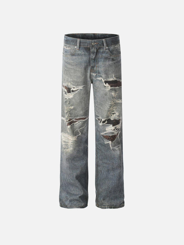 Front view of blue fringe distressed jeans by TALISHKO, showcasing urban fashion style.