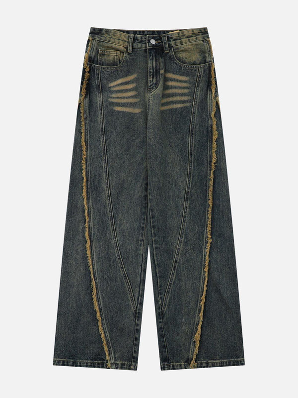 Fringe washed jeans in blue by TALISHKO, showcasing distressed details on the front.