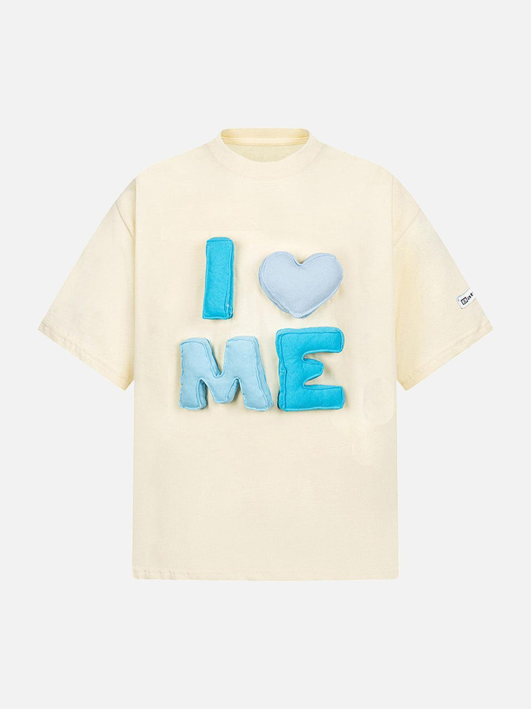 Front view of an apricot "I Love Me" T-shirt by TALISHKO, featuring playful blue lettering.