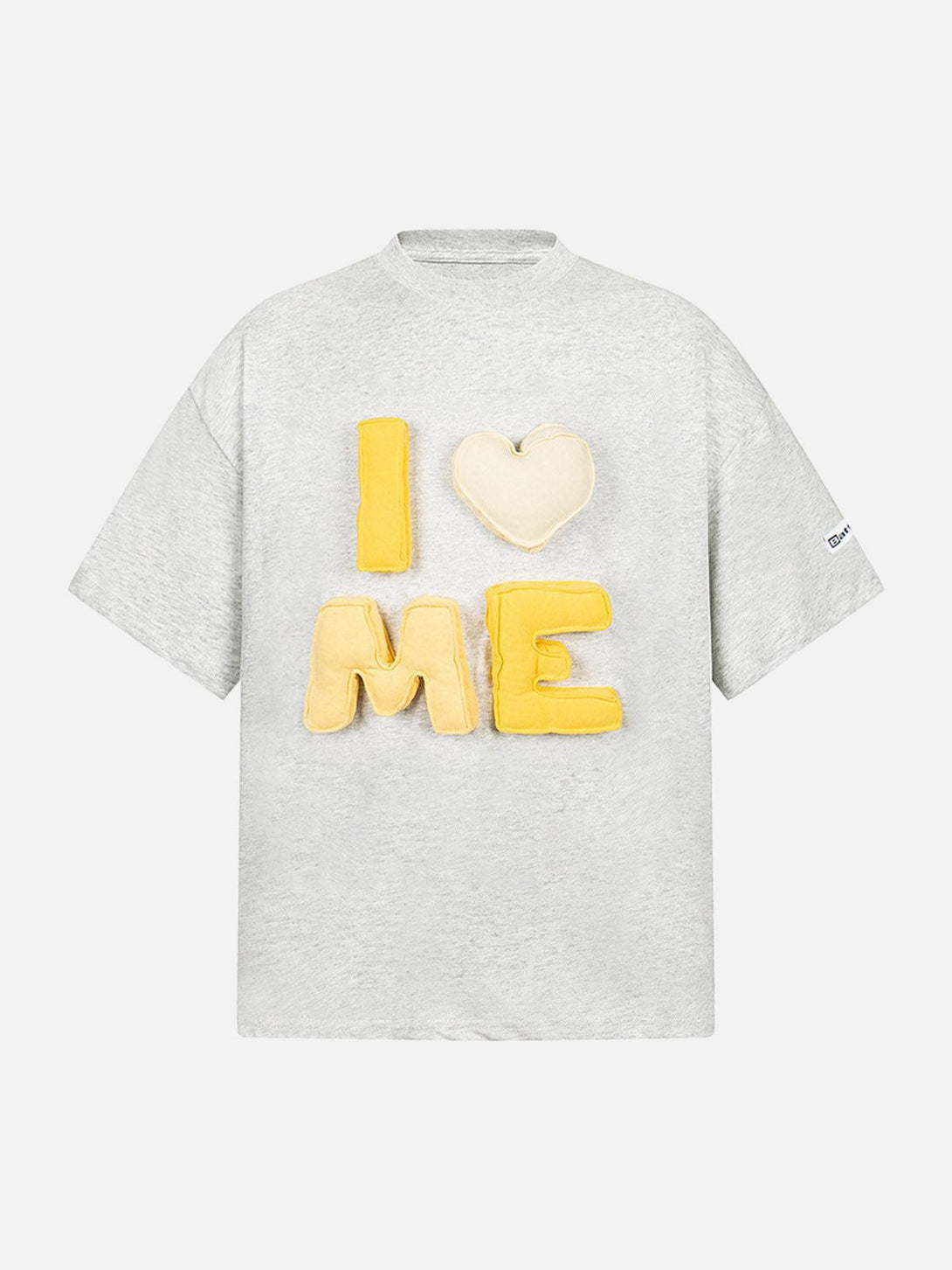 Front view of a gray "I Love Me" T-shirt by TALISHKO, showcasing vibrant yellow lettering.