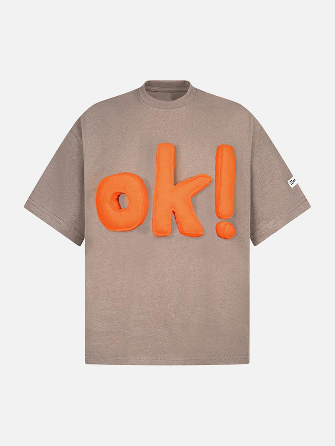 Front view of coffee-colored graphic T-shirt with bold orange "OK!" design by TALISHKO.