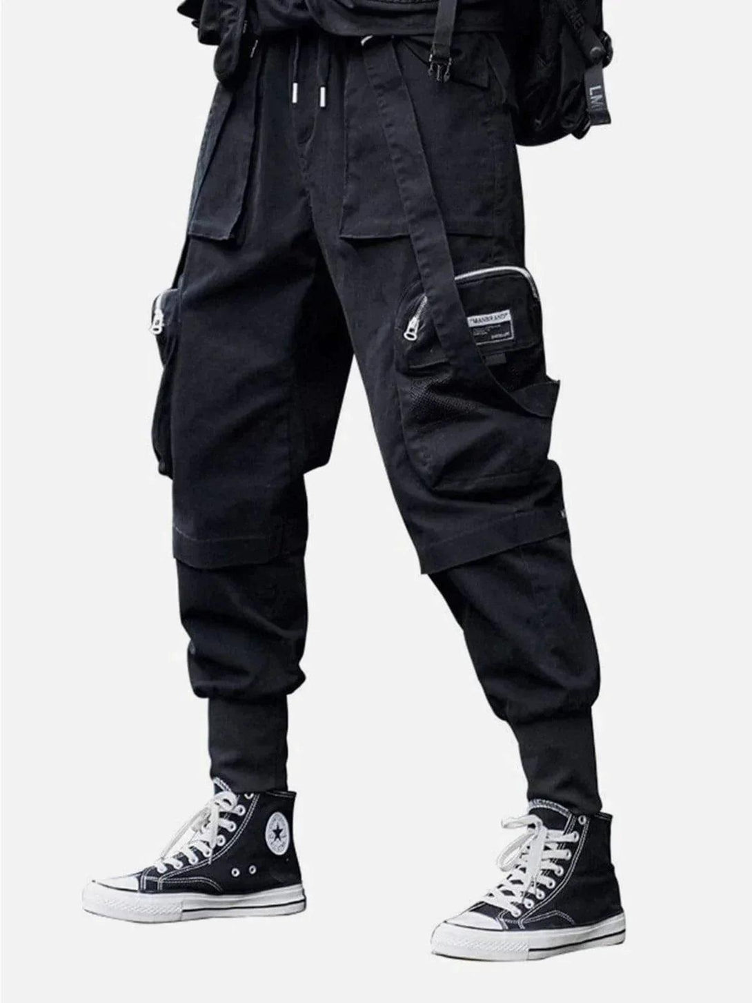 Men's black cargo pants with ribbons and pockets, styled with sneakers by TALISHKO.