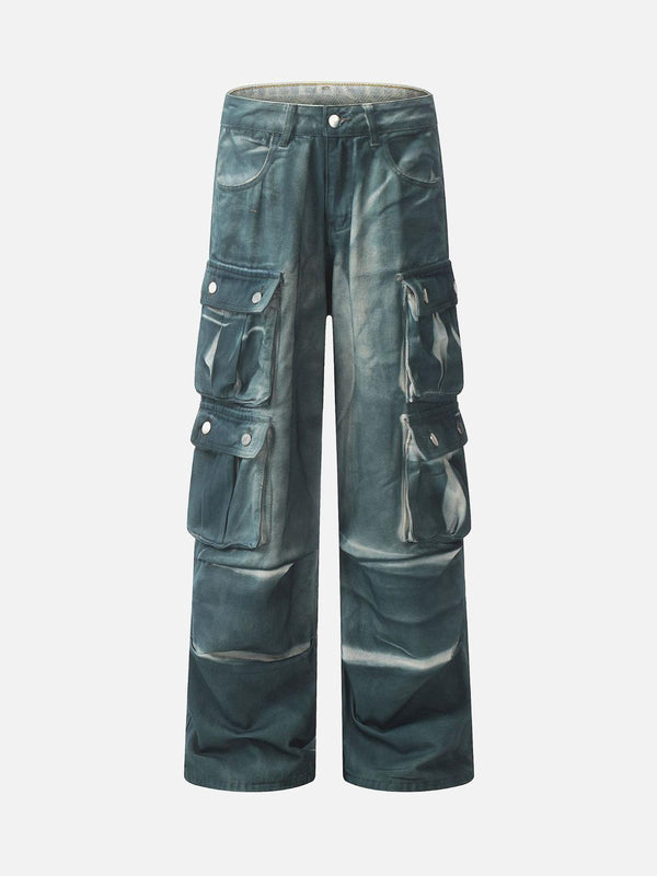Front view of blue gradient dip dye cargo jeans by TALISHKO, featuring multiple pockets.