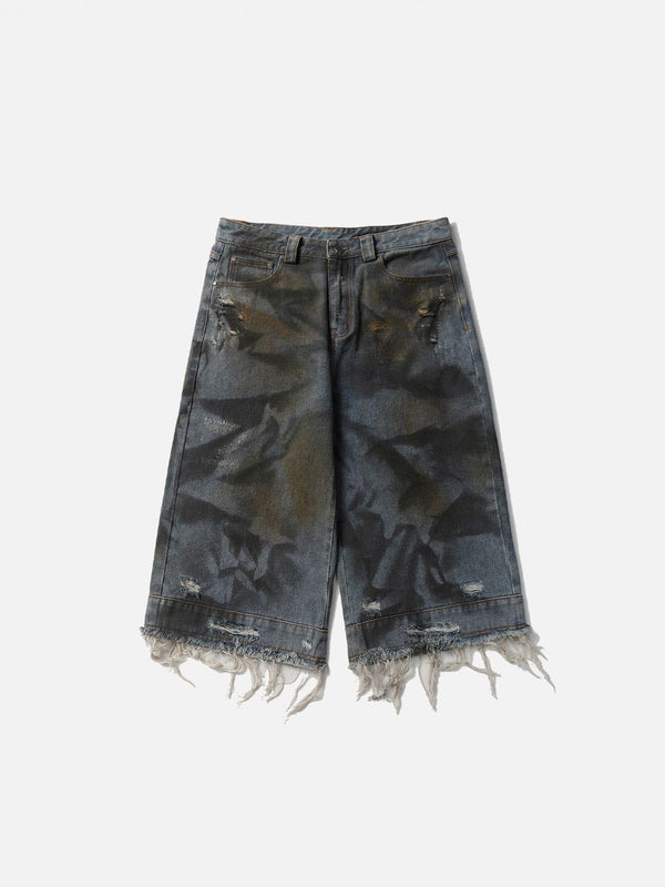 Front view of blue graffiti fringe jorts by TALISHKO, showcasing a bold, edgy design.