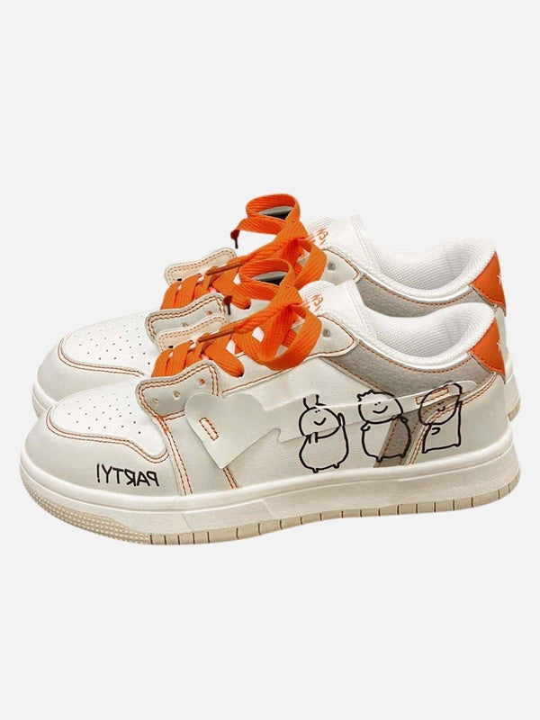 TALISHKO beige sneakers with orange accents and playful graffiti details, front view.