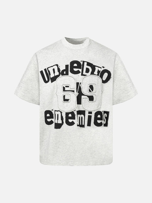 Light gray graphic T-shirt by TALISHKO featuring bold black lettering, shown from the front.