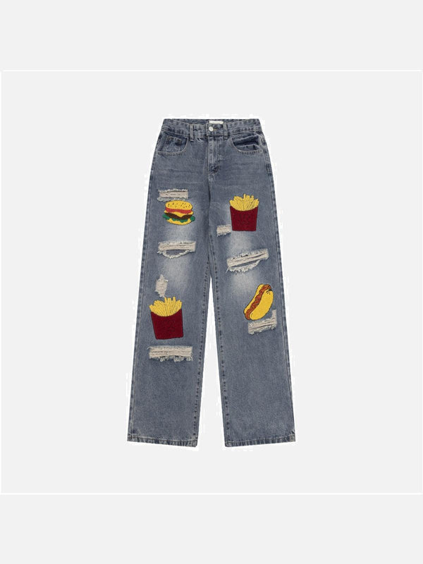 Front view of blue TALISHKO ripped jeans with playful food patches, perfect for casual wear.