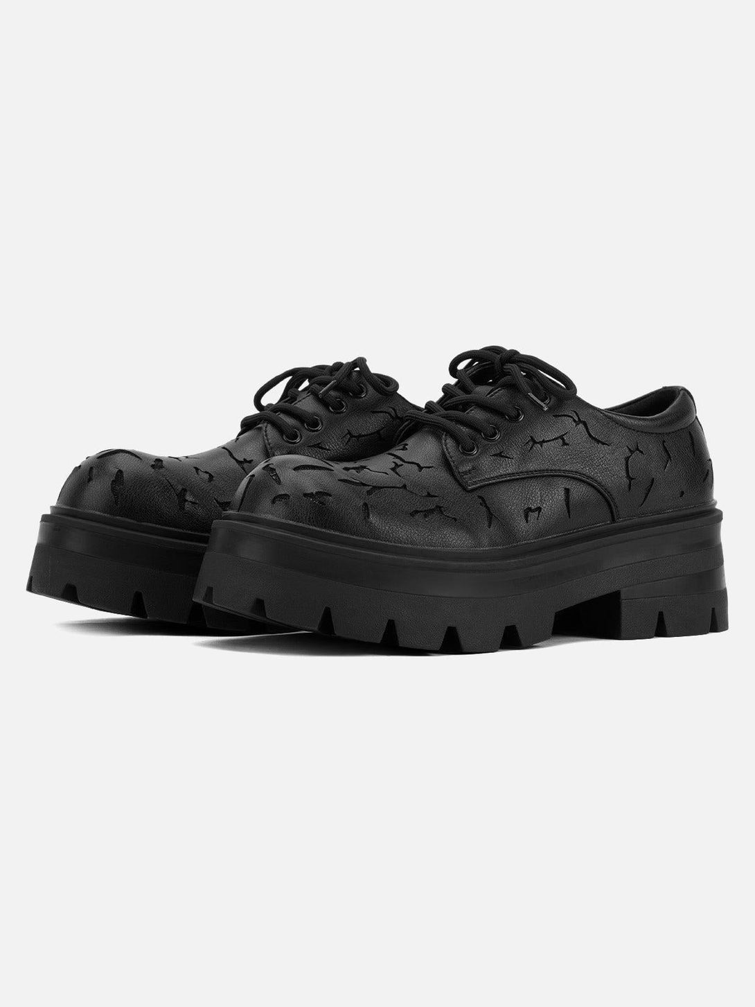 Front view of black crackle leather shoes by TALISHKO, featuring chunky soles and textured design.