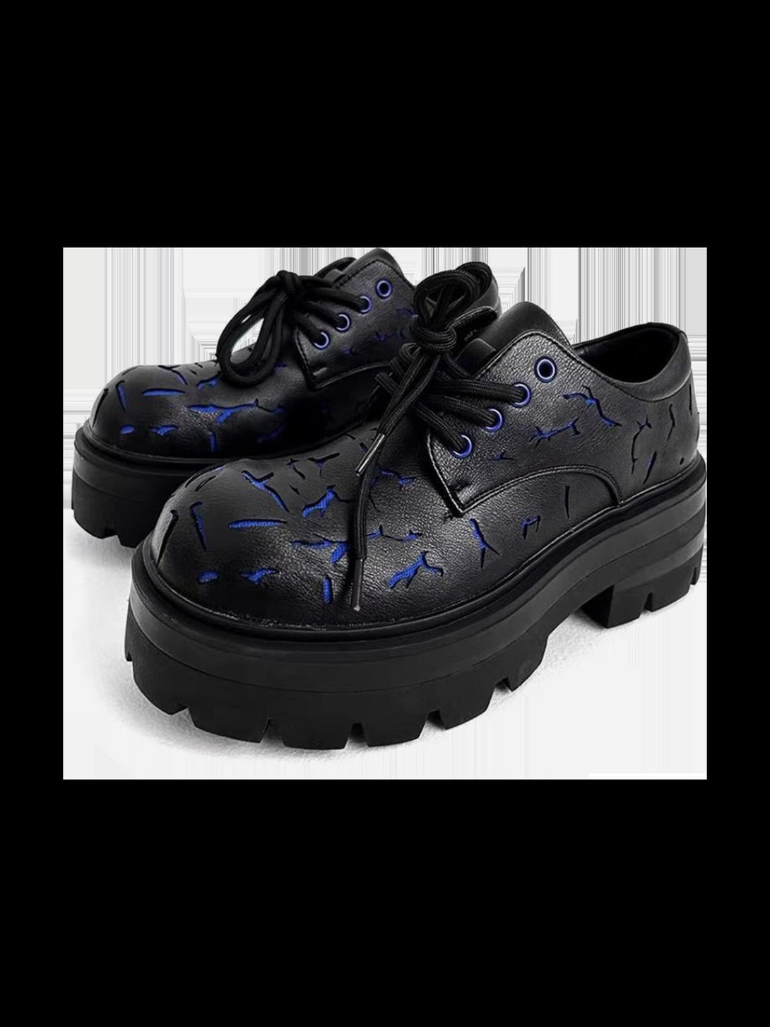 Front view of TALISHKO crackle leather shoes with blue accents and chunky black soles.