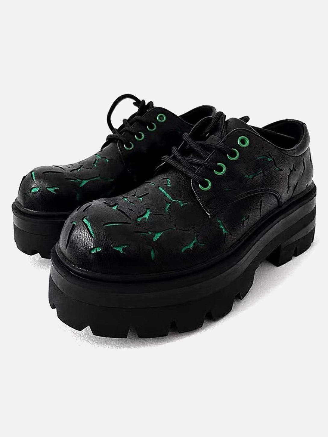 Front view of TALISHKO crackle leather shoes with green accents and chunky black soles.