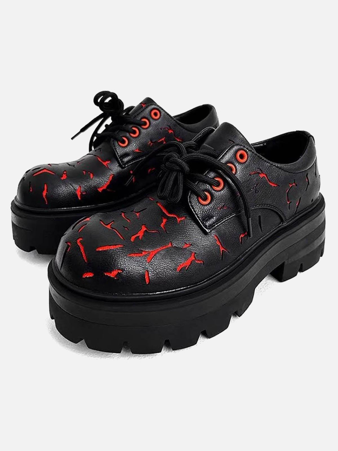 Front view of TALISHKO crackle leather shoes with bold red accents and chunky black soles.
