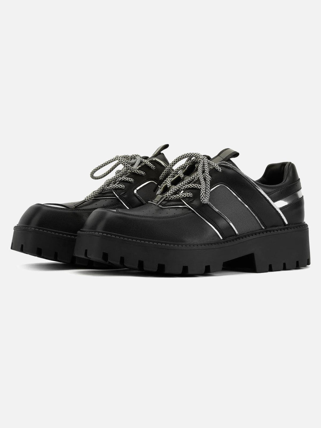 Front view of black leather shoes with metal design and chunky soles by TALISHKO.