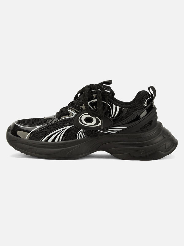 Side view of black TALISHKO sports casual shoes with dynamic patterns, ideal for street style.