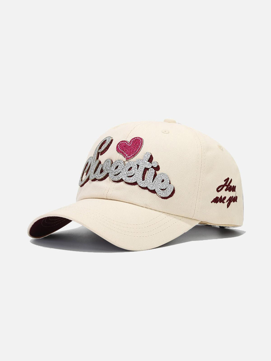 Beige cap with "Sweetie" embroidery and heart detail in front, designed by TALISHKO.