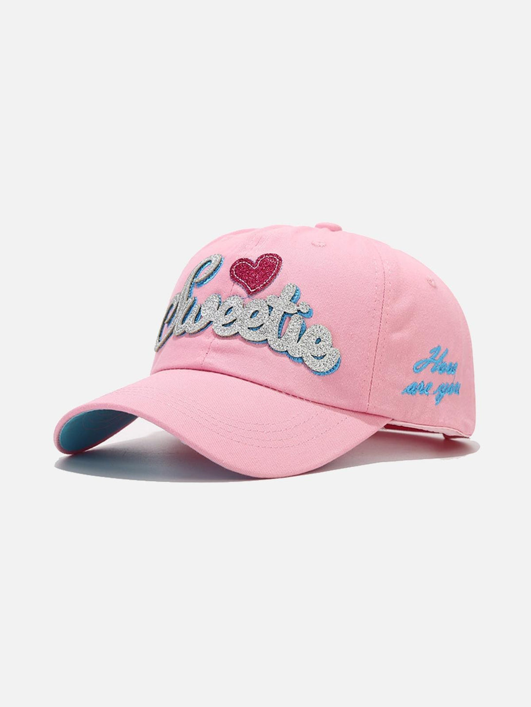 Pink baseball cap with "Sweetie" and heart embroidery by TALISHKO, viewed from the front.