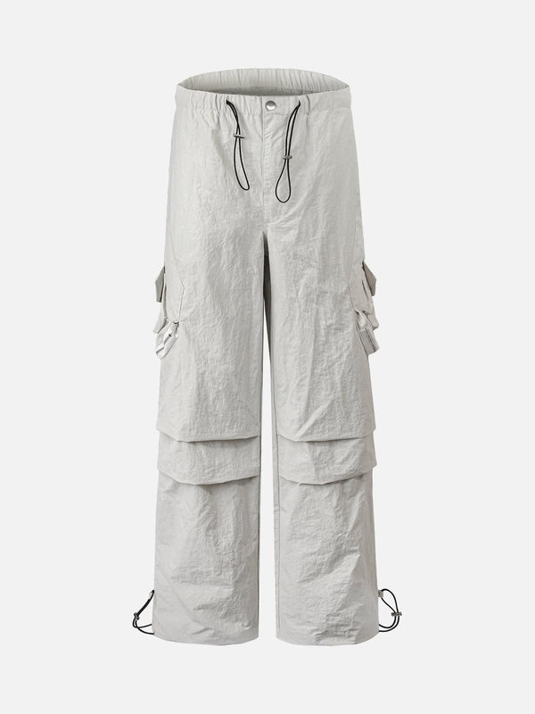 Front view of TALISHKO white cargo pants with multi-pocket design, ideal for urban style.