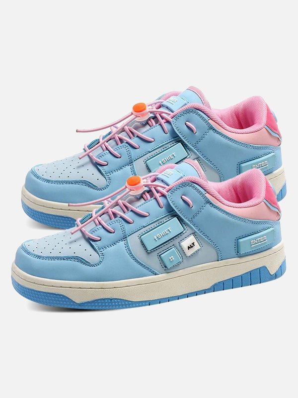 Sky blue skate shoes by TALISHKO, featuring pink accents and unique button details in a streetwear style.