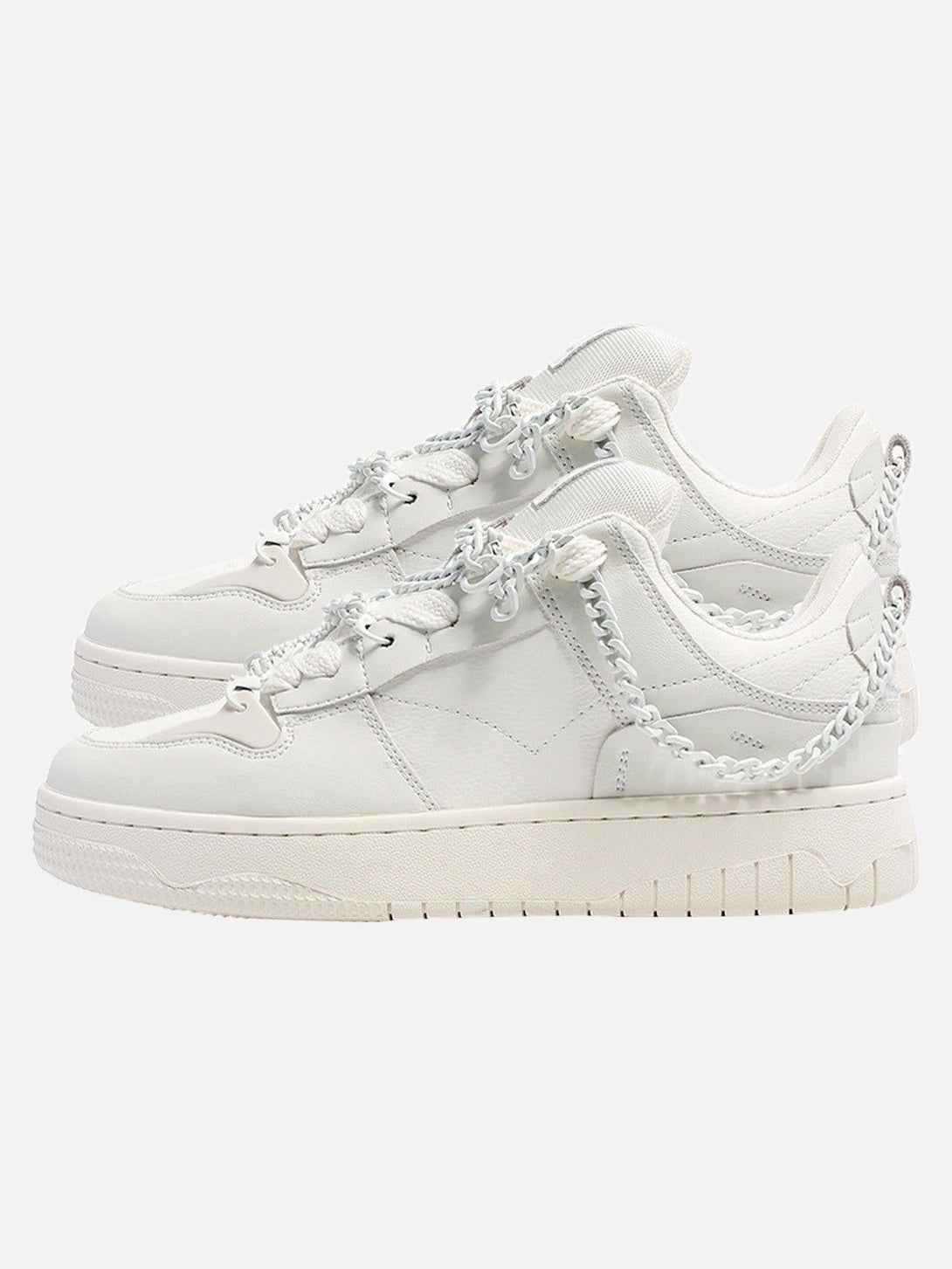 Side view of stylish white sneakers with chain detailing by TALISHKO, perfect for urban fashion.