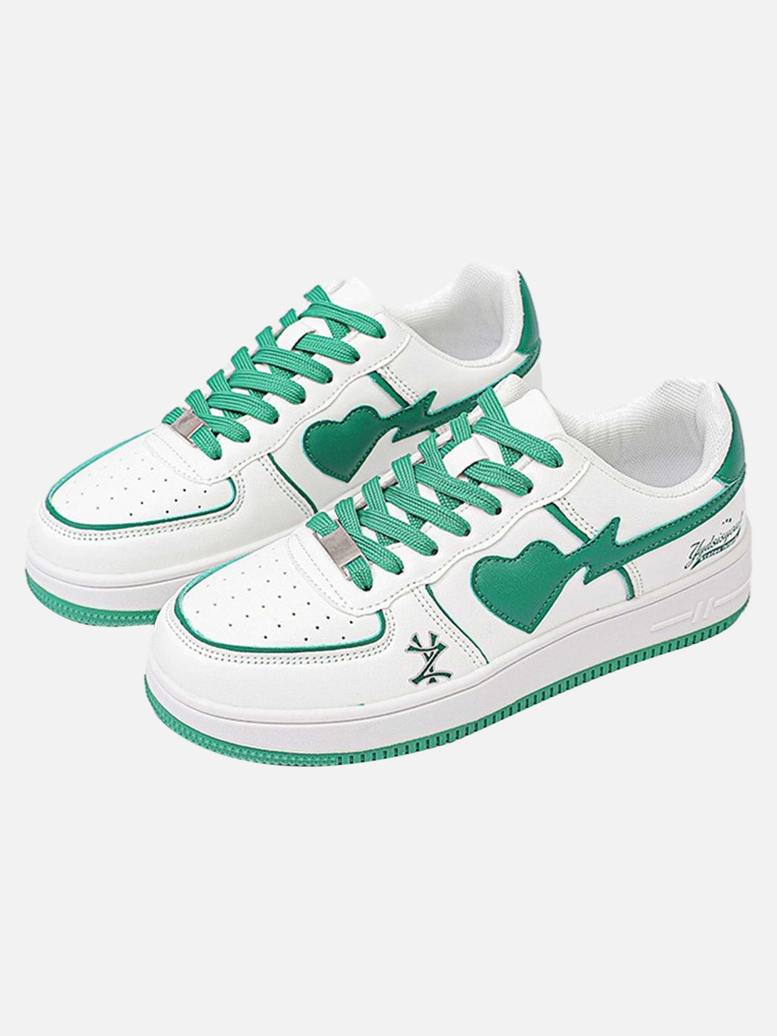 Stylish white skate sneakers with green accents by TALISHKO, showcasing a bold heart design.