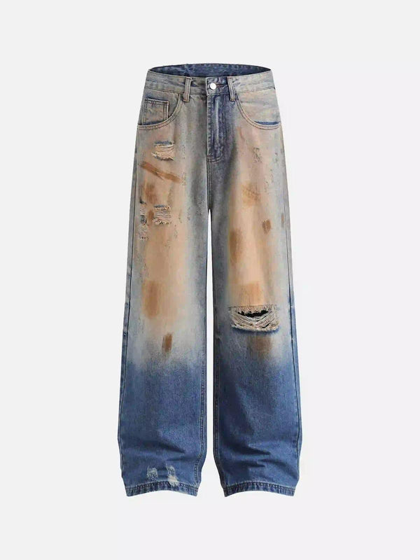 Front view of blue hip-hop ripped mud-dyed jeans by TALISHKO, featuring a relaxed fit.