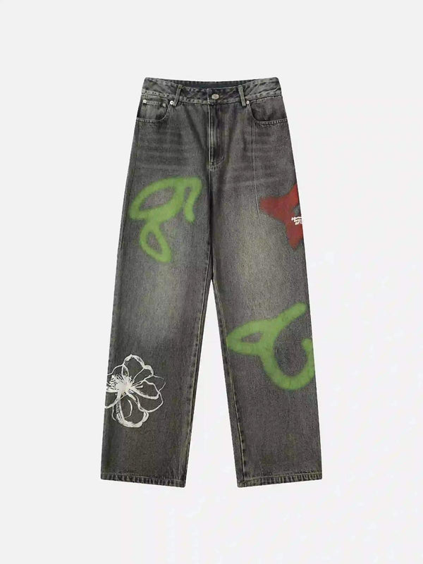 Front view of blue graffiti jeans by TALISHKO, featuring bold green and white designs.