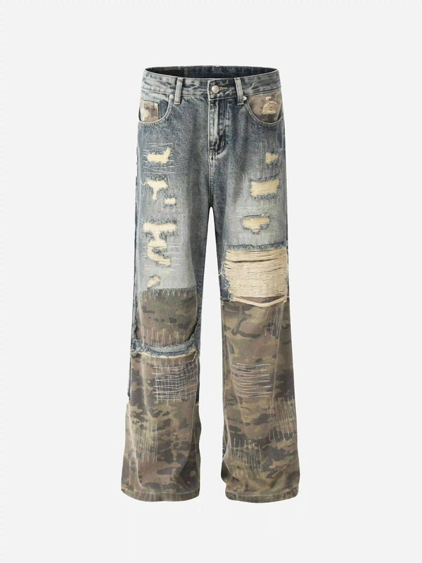 Front view of TALISHKO's blue hip hop ripped jeans featuring camo patches and distressed details.