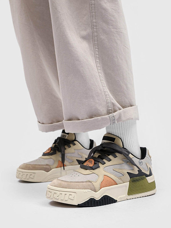 Model wearing khaki casual skate shoes by TALISHKO, featuring layered textures and bold design.