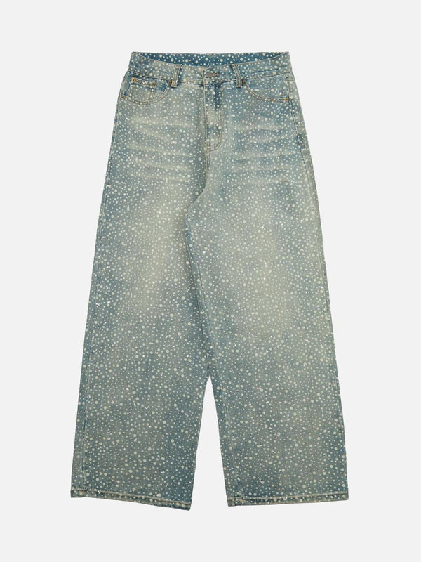 Front view of TALISHKO blue baggy jeans with ink-splashed rhinestone detailing.