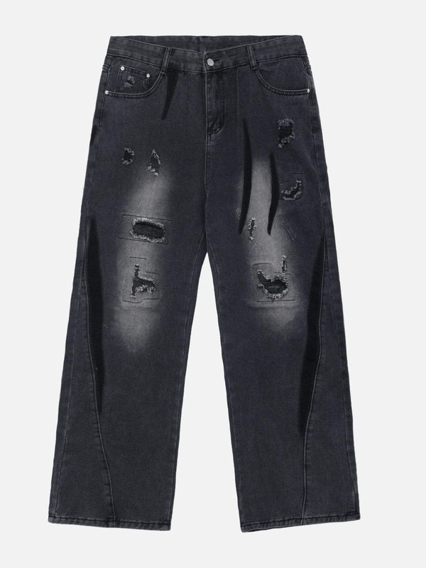 Front view of black irregular patch ripped jeans by TALISHKO, showcasing a trendy design.