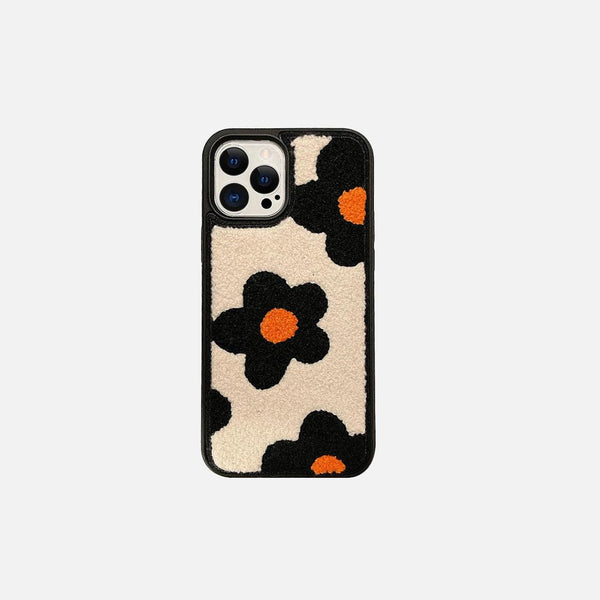 Front view of a Korean plush charm iPhone case by TALISHKO, featuring a floral pattern.