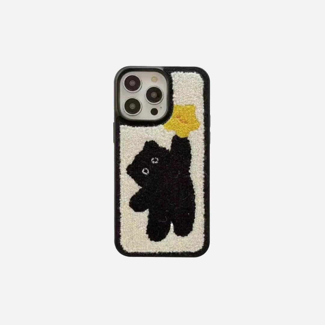 Front view of a Korean plush iPhone case by TALISHKO, featuring a cute bear design on a yellow background.