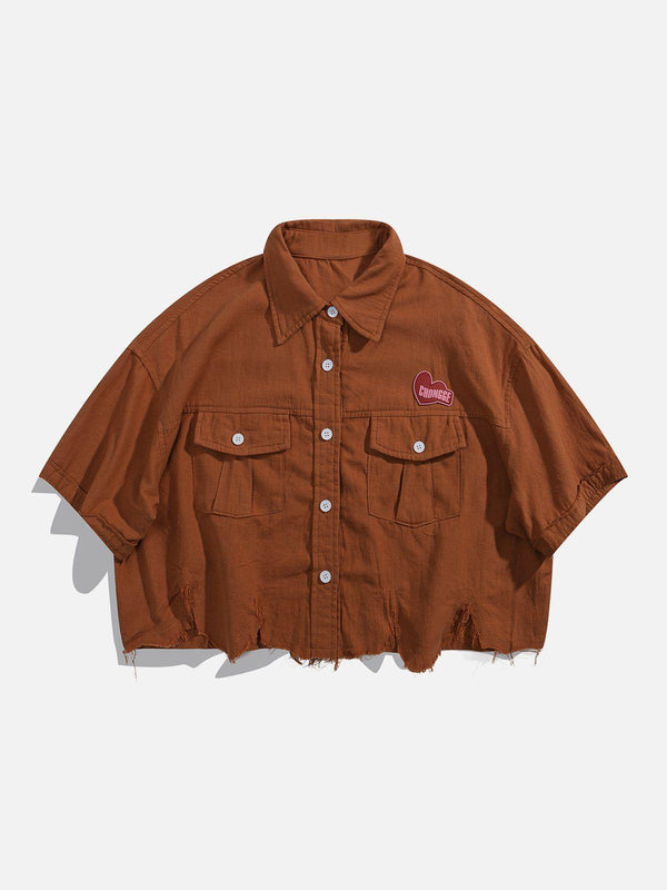 Front view of a brown cropped shirt by TALISHKO, featuring a frayed hem and button details.