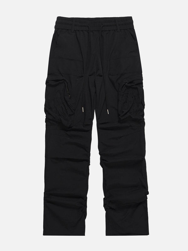 Black cargo pants with large pockets and wrinkle texture, front view by TALISHKO.